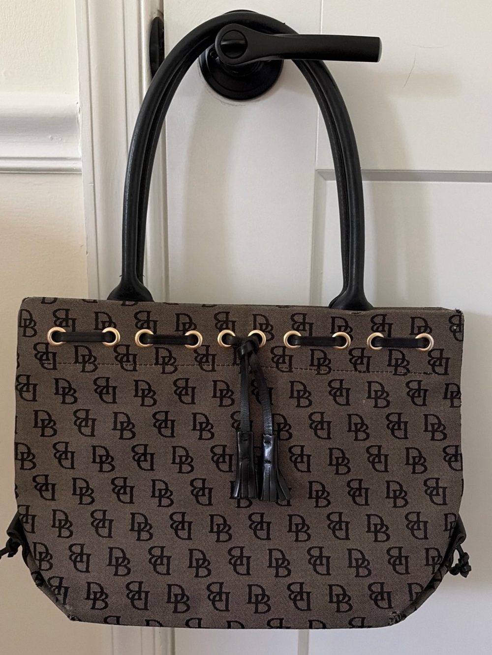 Dooney & Bourke Brown Monogram Tote with Tassel Drawstring